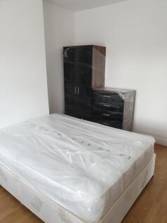 Spacious double bedroom featuring a fresh, mode...