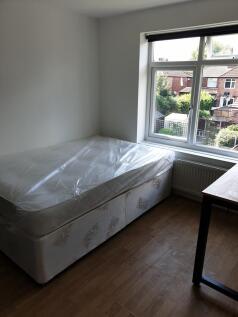 Bright and airy double bedroom featuring a larg...