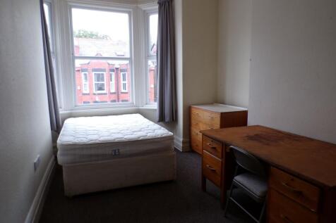 A bright and spacious double bedroom featuring ...
