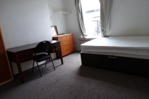 A spacious and well-lit double bedroom ideal fo...