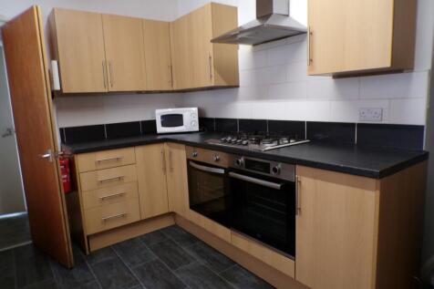 A modern and tidy kitchen with ample storage an...
