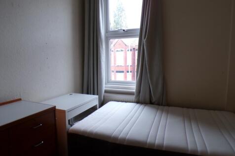 A tidy and well-lit double bedroom, perfect for...