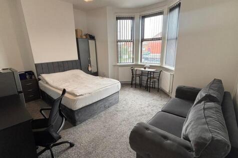 A spacious and well-maintained master bedroom f...