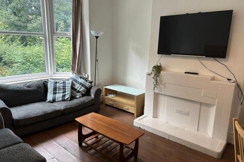 Bright and welcoming living room with large win...