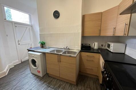 A well-organized kitchen featuring wooden cabin...