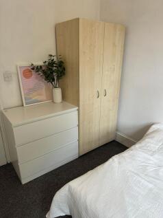 A bright and inviting double bedroom featuring ...