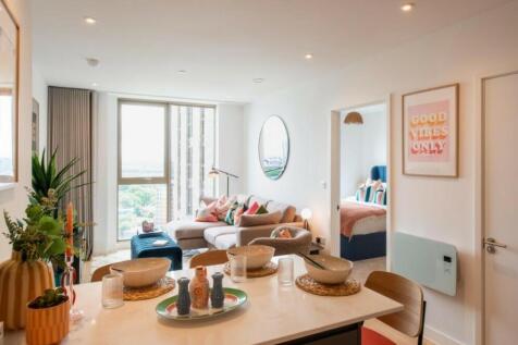 A spacious and modern living room with bright n...