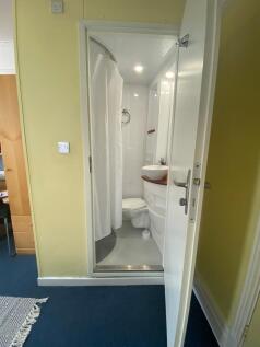 A clean and modern bathroom featuring a spaciou...