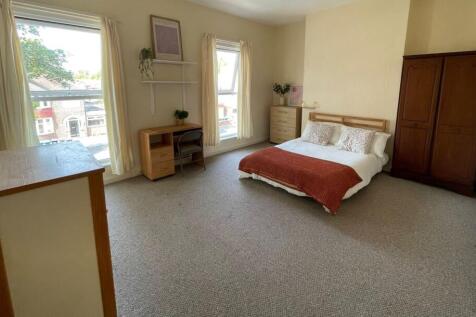 Bright and cozy bedroom featuring a double bed ...