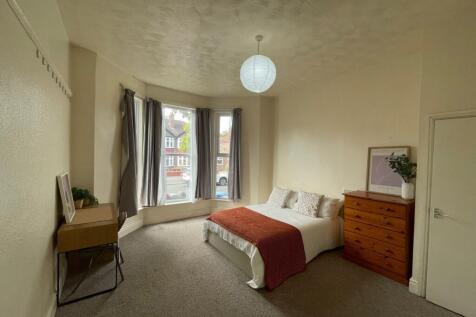 Bright and inviting master bedroom featuring a ...