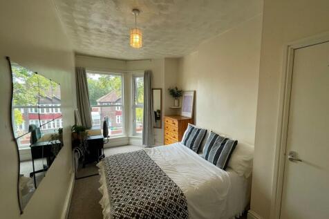 Bright and inviting double bedroom featuring a ...