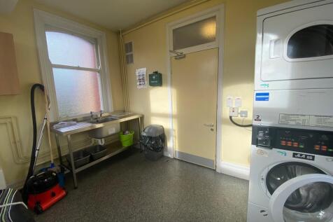 A bright and clean kitchenette equipped with mo...