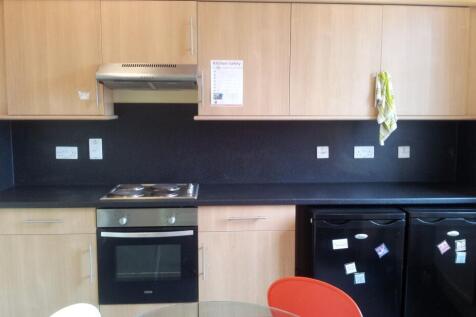 A tidy and functional kitchenette with modern a...