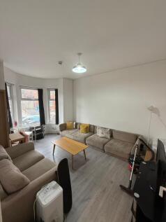 A comfortable and functional living room featur...