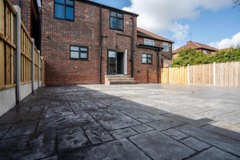 Spacious outdoor garden area featuring well-mai...