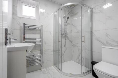 This modern bathroom features a sleek design wi...