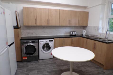 This modern kitchen features ample storage with...