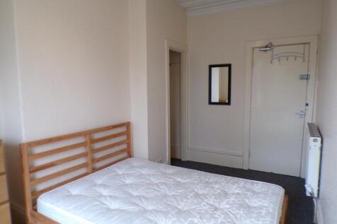 Spacious double bedroom featuring a minimalist ...