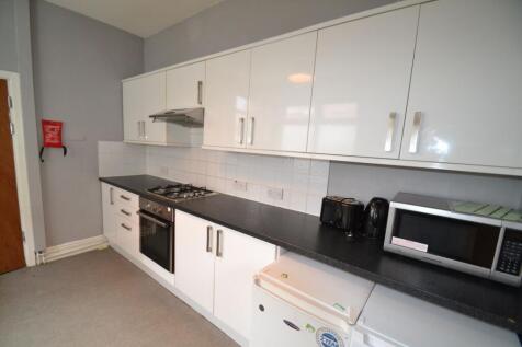 Bright and modern kitchen featuring spacious co...