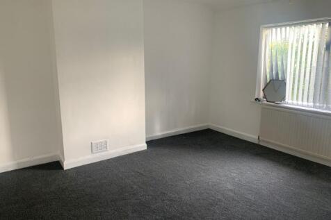 A bright and clean double bedroom featuring a l...