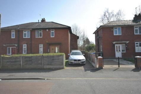 Front view of a neat semi-detached house with a...