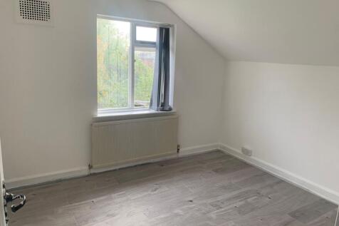 A bright and clean single bedroom featuring a l...