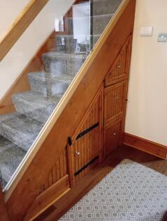 A neat and well-maintained staircase area with ...