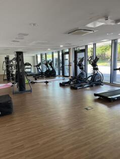 Bright and spacious gym featuring a range of mo...