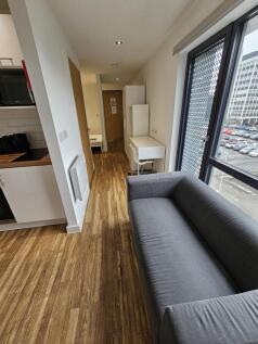 Modern and bright living room featuring a comfo...