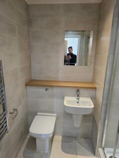 A modern, well-maintained bathroom featuring a ...