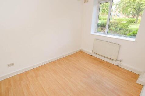 Bright room with a large window overlooking a g...