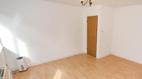 Bright room with natural light and clean wooden...