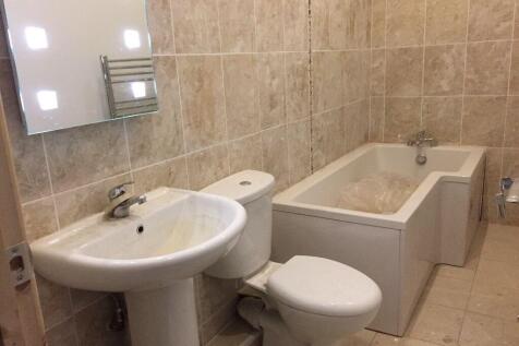 A clean and modern bathroom suite featuring a w...