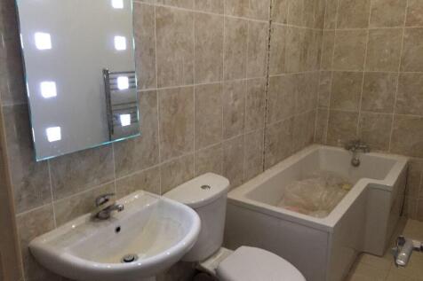 A well-maintained bathroom suite featuring a mo...