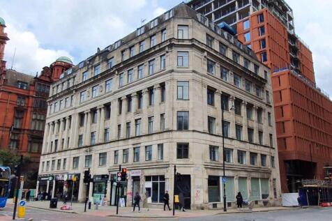 Impressive corner view of a classic multi-story...