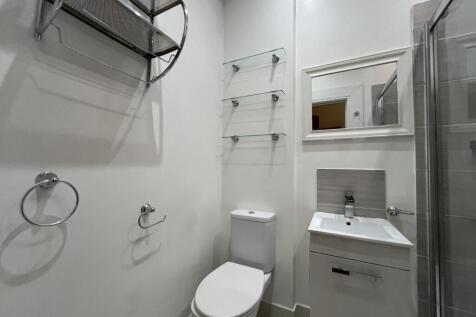 A modern, well-maintained bathroom featuring a ...