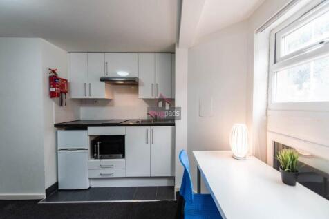 Bright and modern kitchen area featuring sleek ...