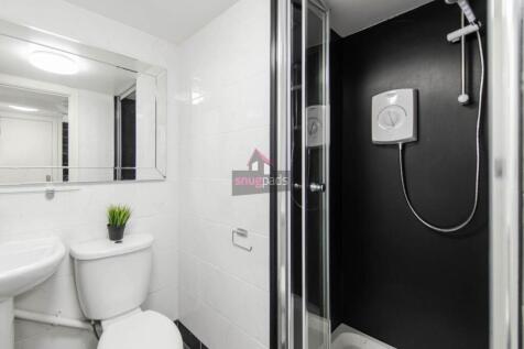 Bright and clean modern bathroom featuring a wa...