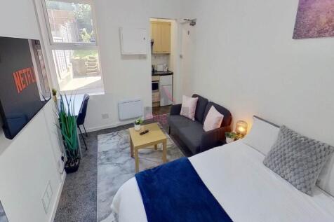 Bright and cozy double bedroom featuring a comf...