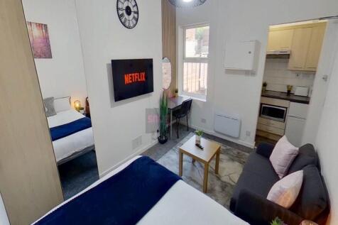 A cozy double bedroom featuring a comfortable d...
