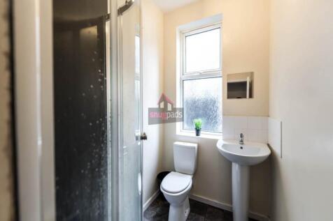 Bright and clean bathroom featuring a modern pe...