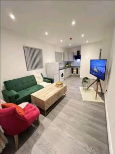 A contemporary living room featuring a stylish ...