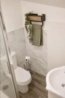 A modern and clean bathroom space featuring a w...
