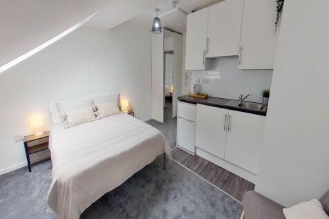 Bright and inviting master bedroom featuring a ...
