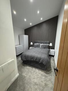 A well-presented double bedroom featuring a spa...