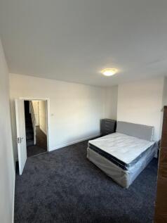 Bright, airy double bedroom featuring a comfort...