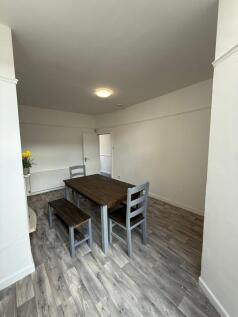 Spacious and tidy living area featuring a woode...