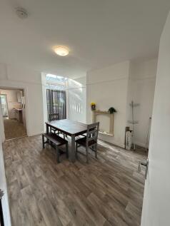 Bright and inviting living space with ample nat...