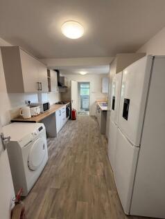 Modern and well-maintained kitchen with ample c...