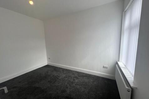 Bright and welcoming living room with a large w...